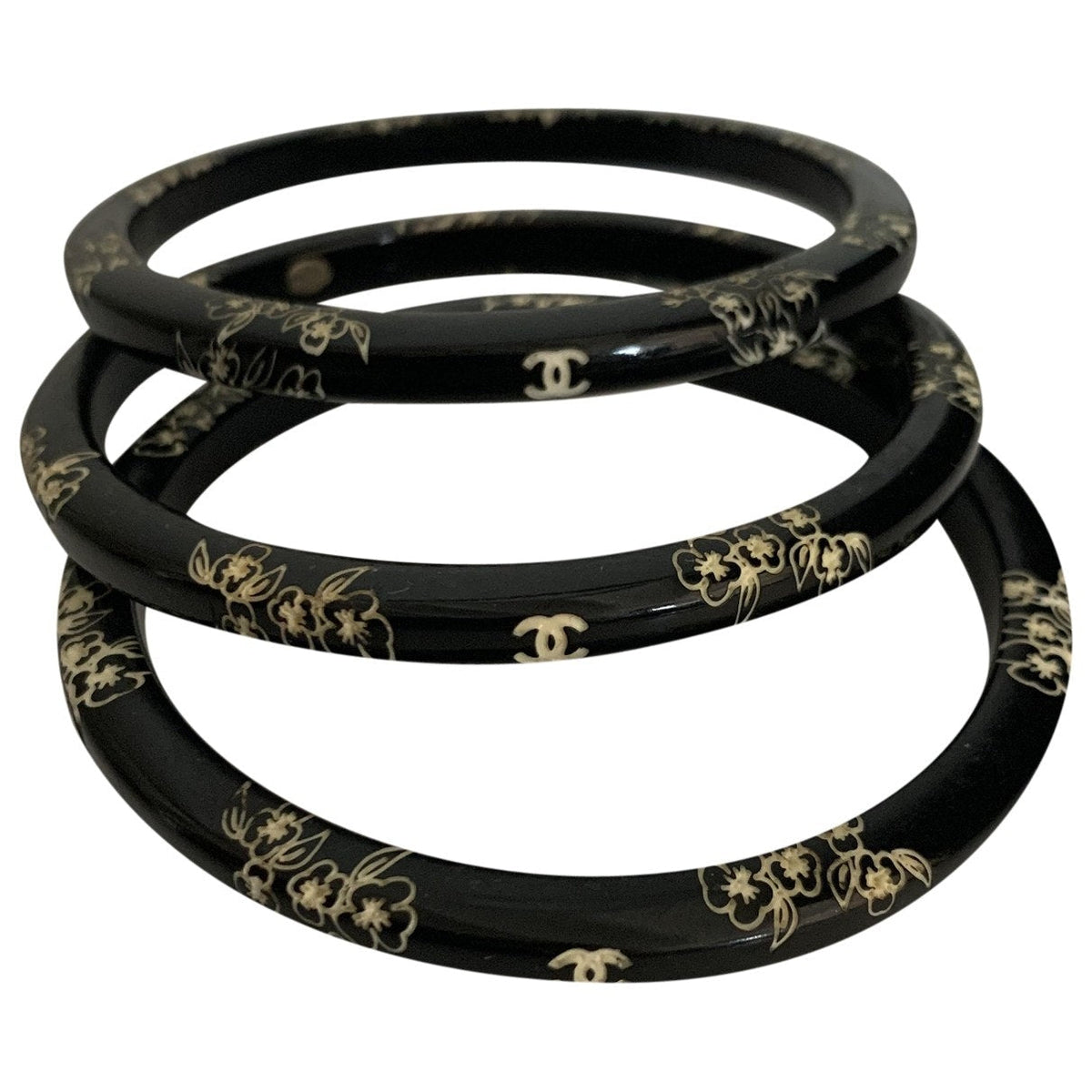 Chanel black plastic bracelets