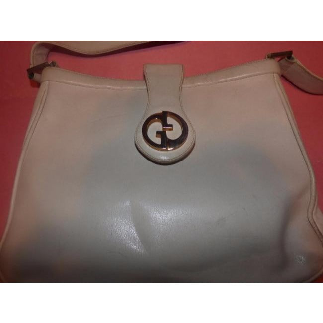 Vintage, mod, Gucci, white leather 1973 shoulder bag with a gold GG flap snap lock