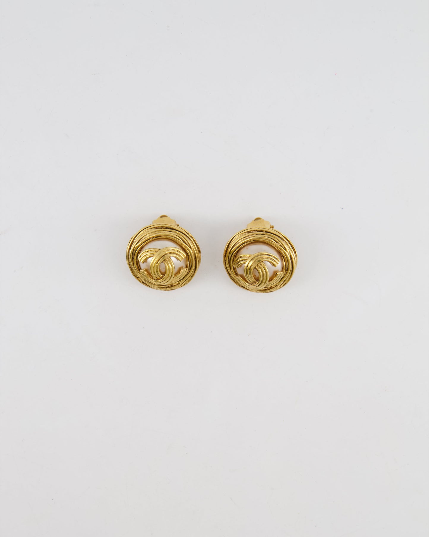 Chanel Vintage 94A Gold Spiral Round Clip On Earrings with Embedded Pearl and Gold CC Logo