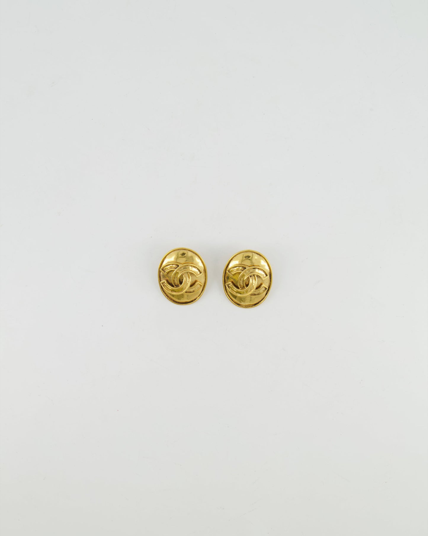 Chanel Vintage 94P Gold Polished Oval Clip On Earrings with CC Logo