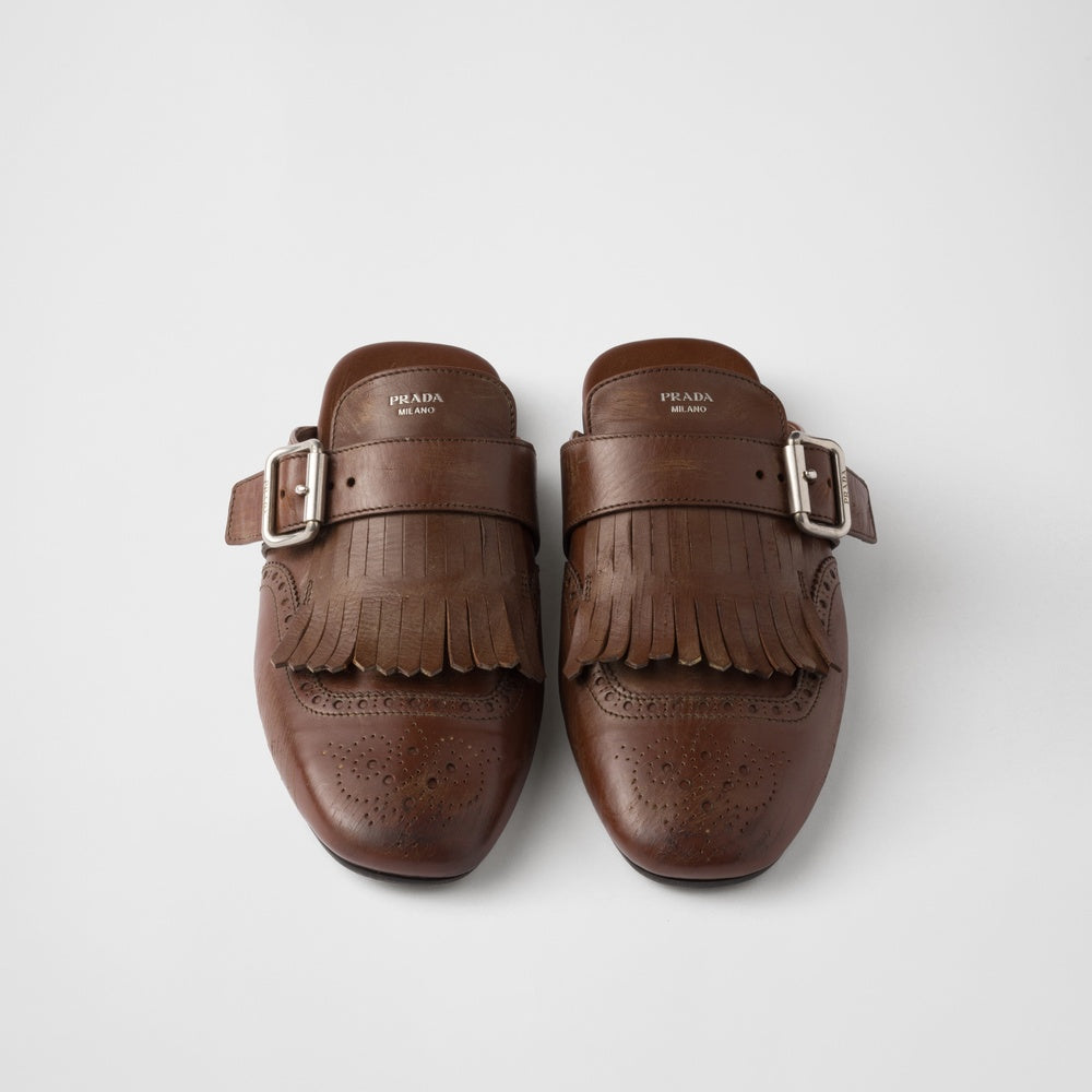 Shuffle fringed leather mules