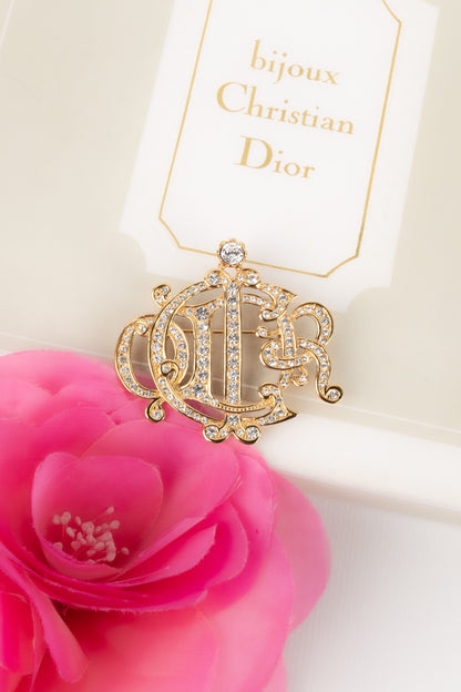 Broche dorée Dior