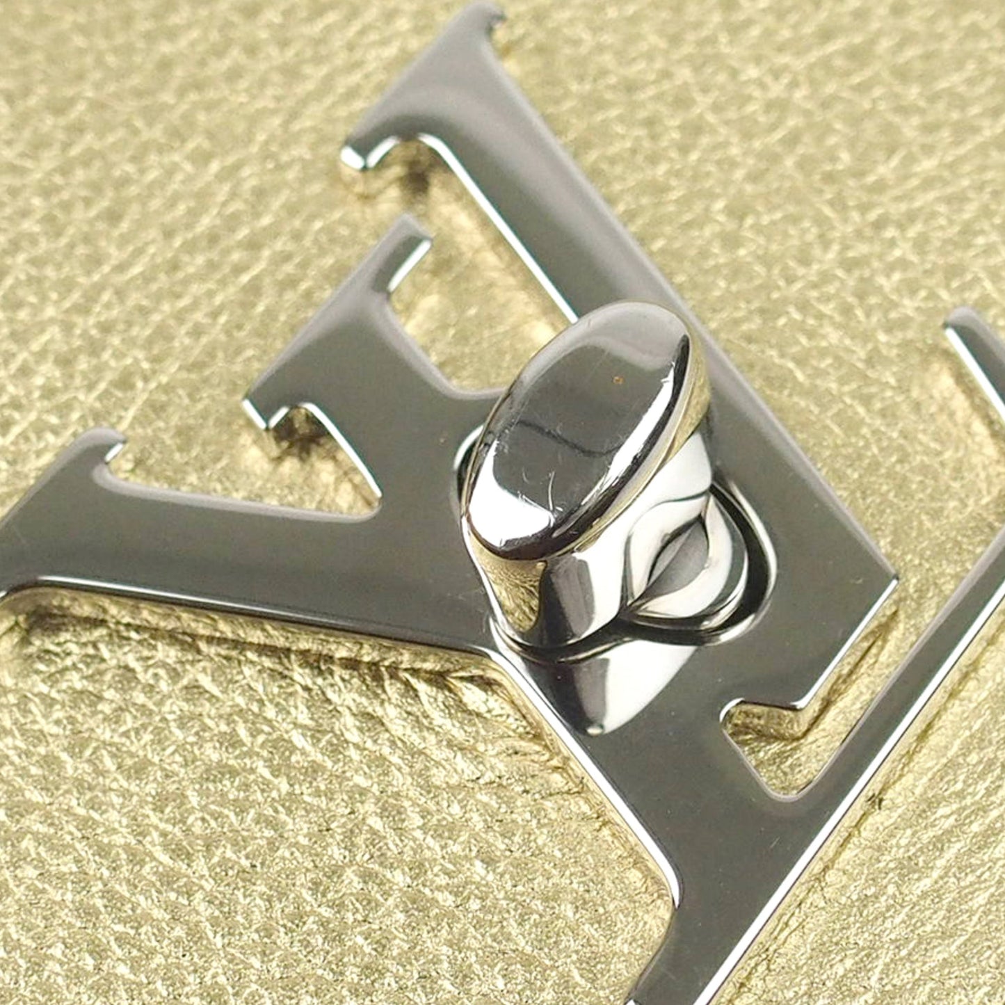 Louis-Vuitton Mini Metallic LockMe Backpack in Metallic Leather Body