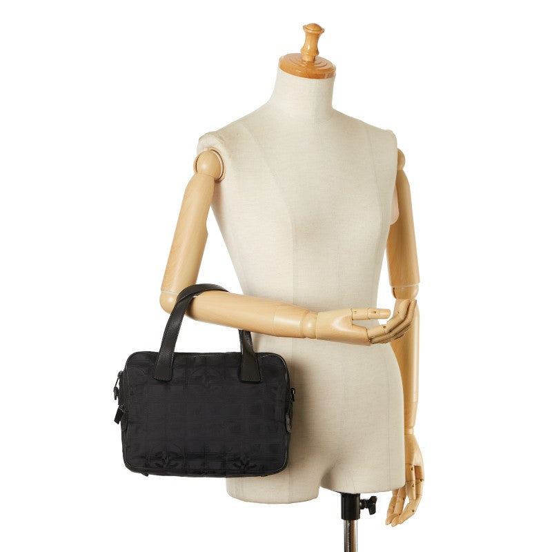 Chanel New Travel Line Handbag Canvas Handbag in Good condition