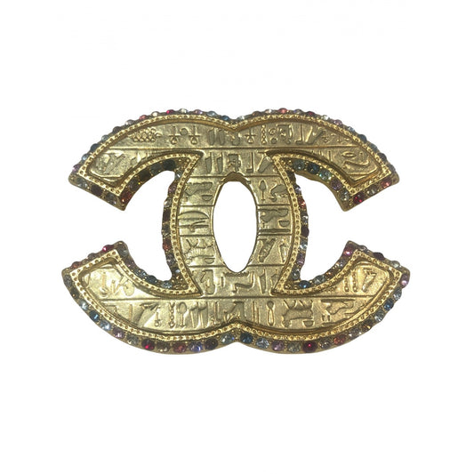 Chanel cc gold metal pins & brooches
