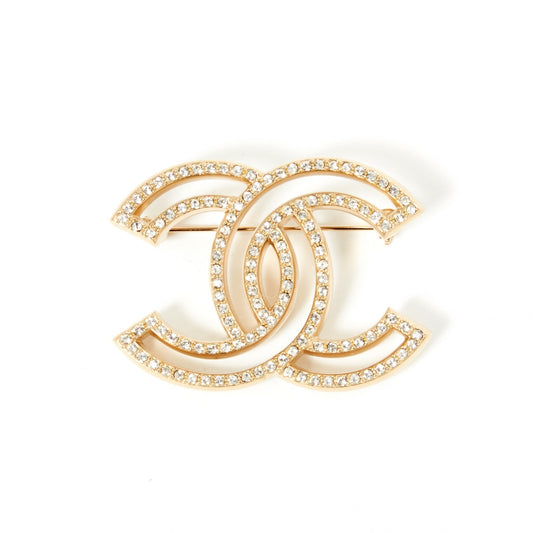 Chanel cc gold metal pins & brooches