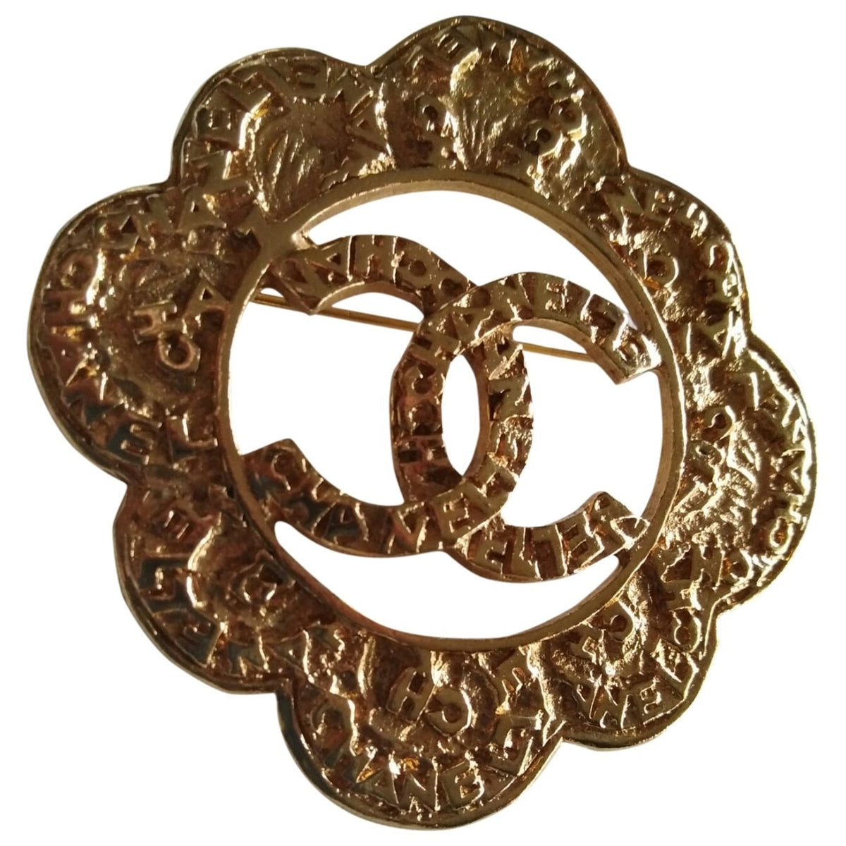 Chanel cc gold metal pins & brooches