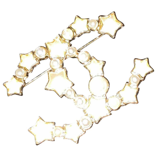 Chanel cc gold steel pins & brooches