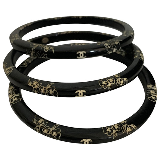 Chanel black plastic bracelets