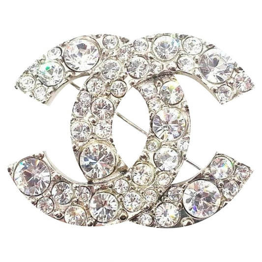 Chanel cc silver metal pins & brooches