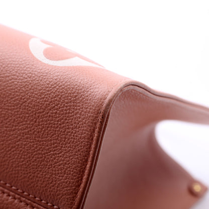 Louis-Vuitton ONTHEGO MM Bicolor Empreinte Giant Monogram Pink