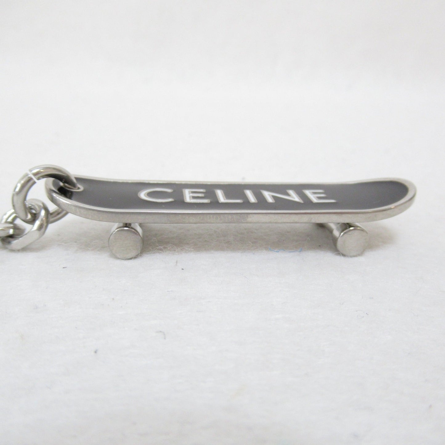 Celine skateboard charm Black White Plastic enamel 49I986BRE 38AW