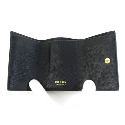 Prada tri-fold wallet leather black gold unisex