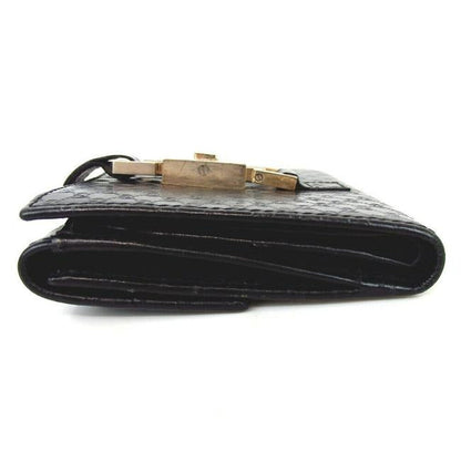OUR MOST LIKED WALLET! Gucci, Jackie style, black micro Guccissima print leather, bi-fold wallet with chrome, Jackie style, push button closure, chrome accents, and lots of slots for your cards!