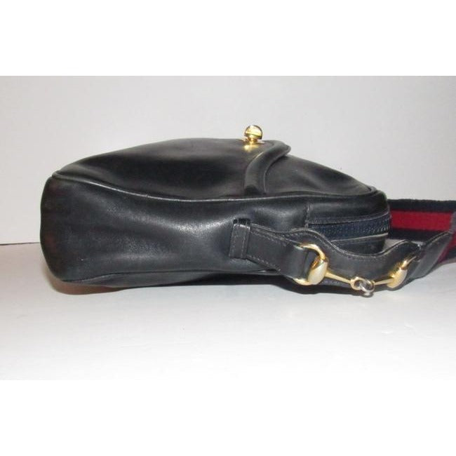SALE! Vintage, Gucci, navy leather, shoulder bag with a zip top closure, front pocket, and a red and navy striped strap with gold horse-bit accents