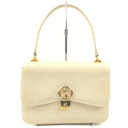Vintage, Gucci, cream leather, 1973 top handle style purse with gold tone accents!