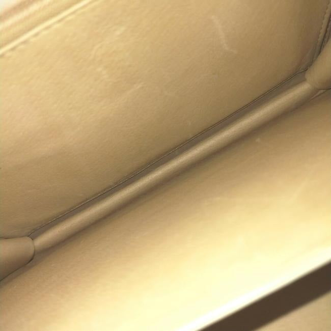 Vintage, Gucci, cream leather, 1973 top handle style purse with gold tone accents!