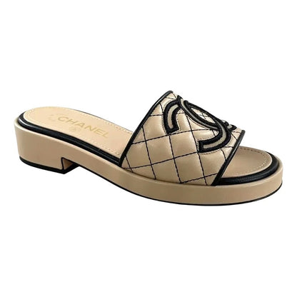 CHANEL CC QUILTED LAMBSKIN LEATHER MULES