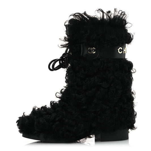 CHANEL INTERLOCKING CC LOGO SHEARLING BOOTS