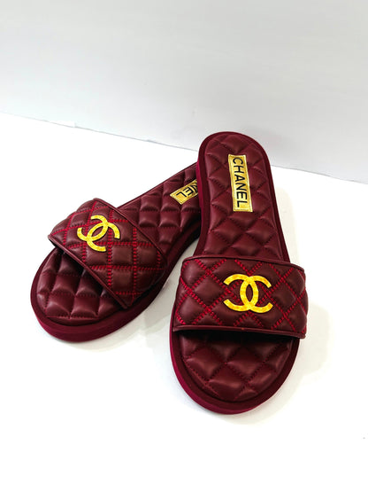 CHANEL INTERLOCKING CC LOGO QUILTED LAMBSKIN MULES