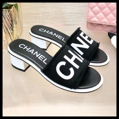 CHANEL LAMBSKIN CHA-NEL SANDLAS MULES