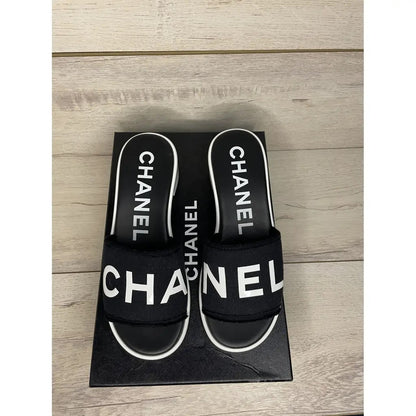 CHANEL LAMBSKIN CHA-NEL SANDLAS MULES