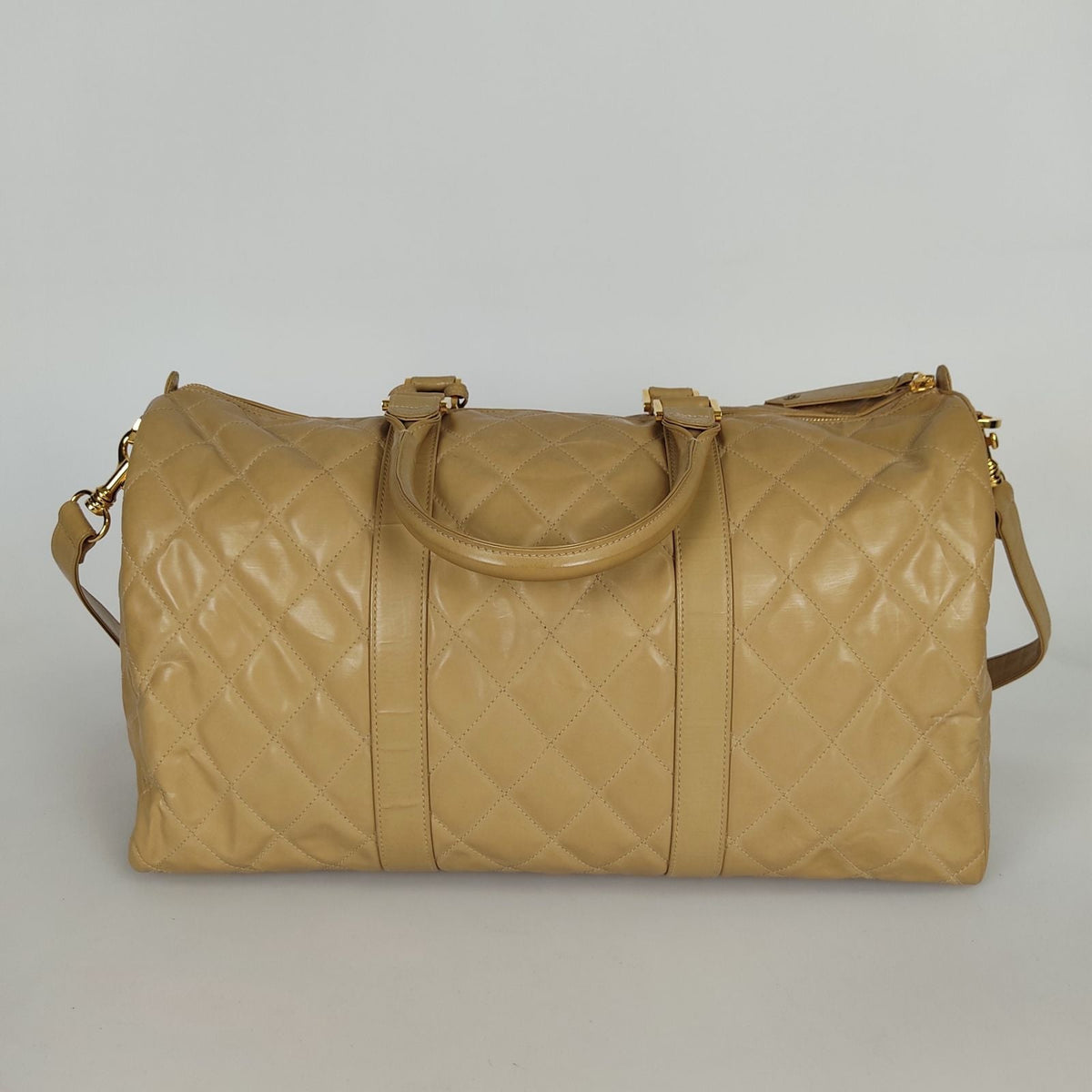 Chanel Chanel Chanel quilted travel bag in beige patent leather