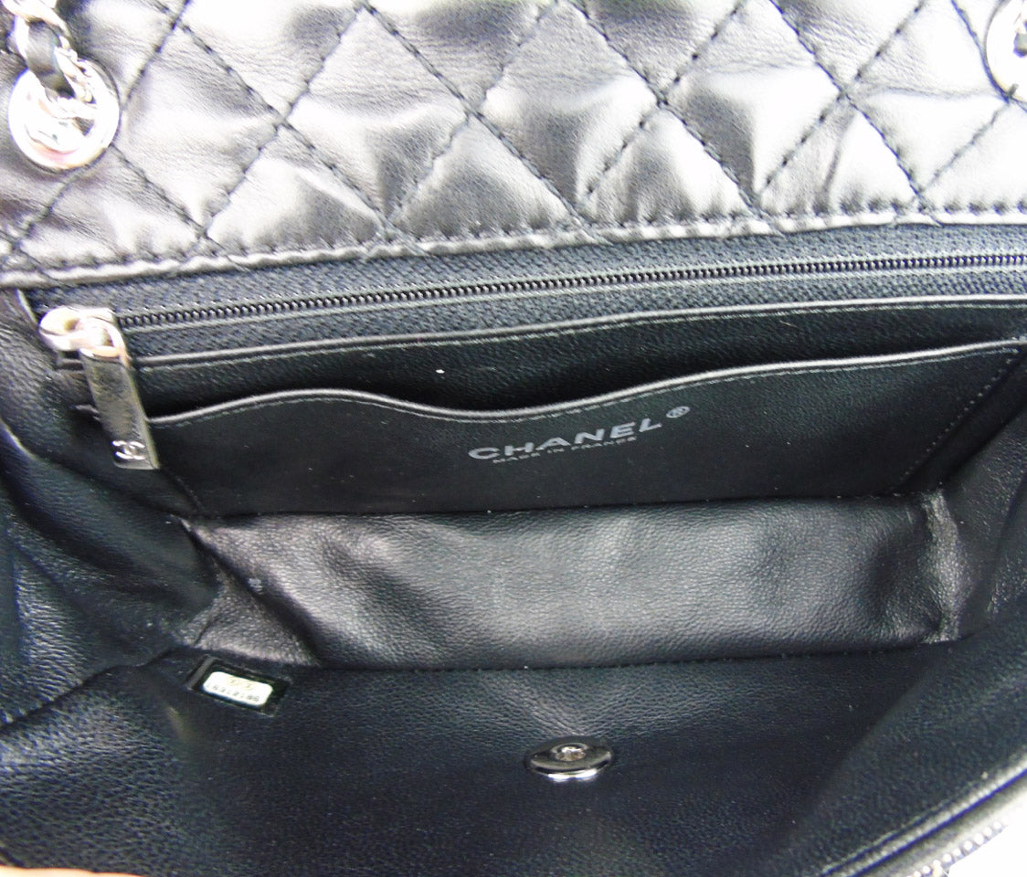 CHANEL 'Follies' black flap bag