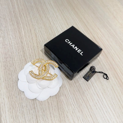 Chanel CC brooch