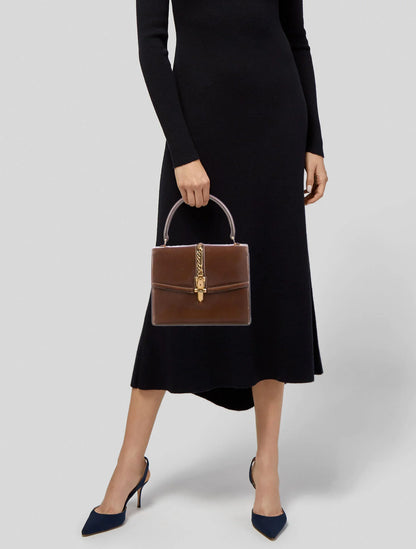 Gucci 1969 Sylvie chestnut brown leather top handle Kelly bag with a gold zipper accent