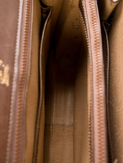 Gucci 1969 Sylvie chestnut brown leather top handle Kelly bag with a gold zipper accent