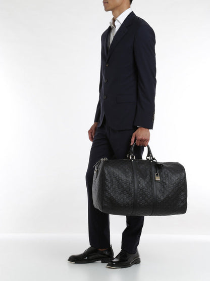 GUCCI GUCCISSIMA BLACK EMBOSSED LEATHER DUFFLE BAG