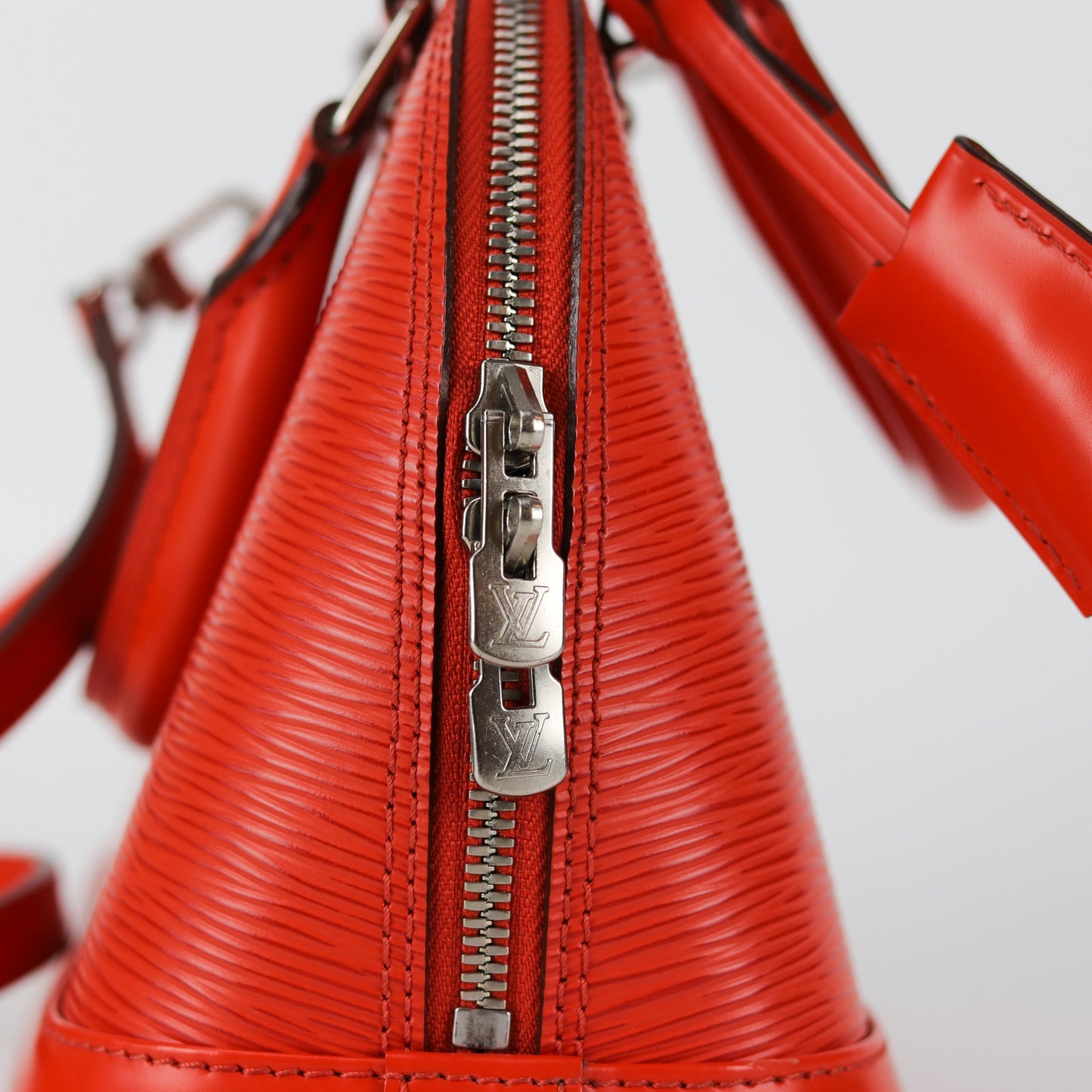 Louis-Vuitton Alma BB Epi Leather in Orange