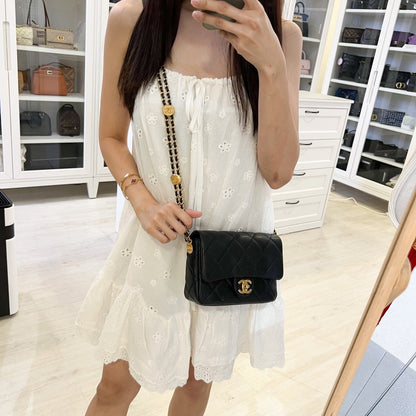 Chanel 22A “Twist Your Buttons” Small / Mini Flap in Black Caviar and AGHW (Model: AS3369)