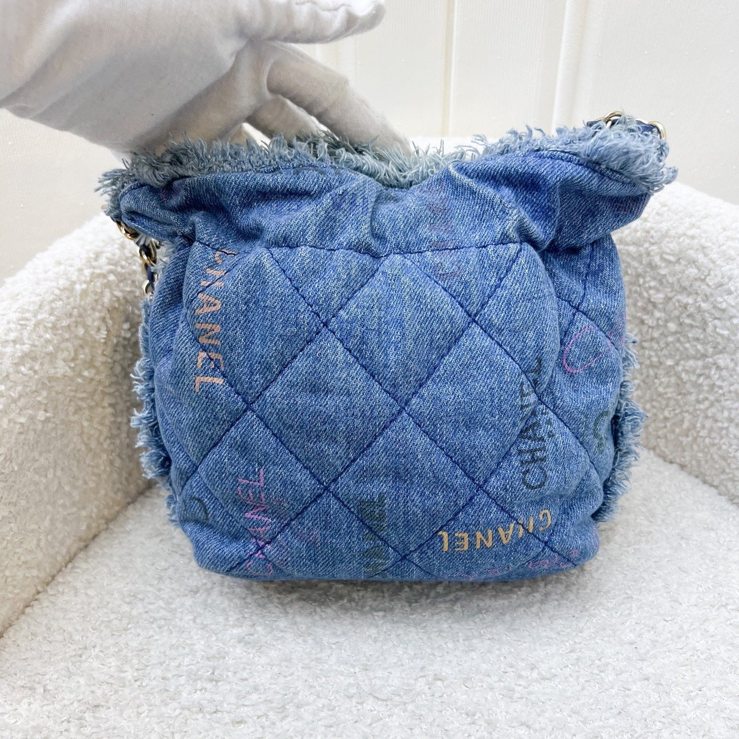 Chanel 22P Denim Mood Mini Drawstring Bucket Bag in Blue Printed Denim and LGHW