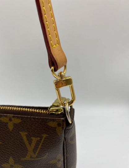 Louis Vuitton Pochette with shoulder strap and crossbody.