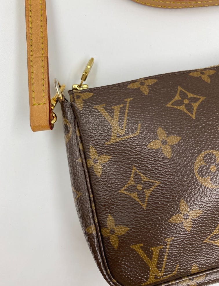 Louis Vuitton Pochette with shoulder strap and crossbody.