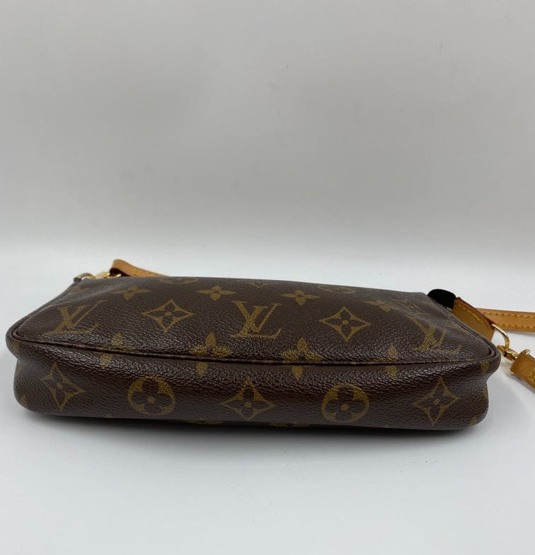 Louis Vuitton Pochette with shoulder strap and crossbody.