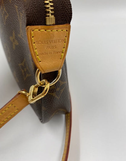 Louis Vuitton Pochette with shoulder strap and crossbody.