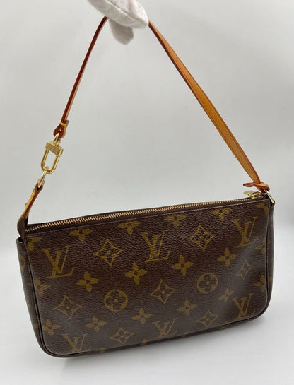 Louis Vuitton Pochette with shoulder strap and crossbody.