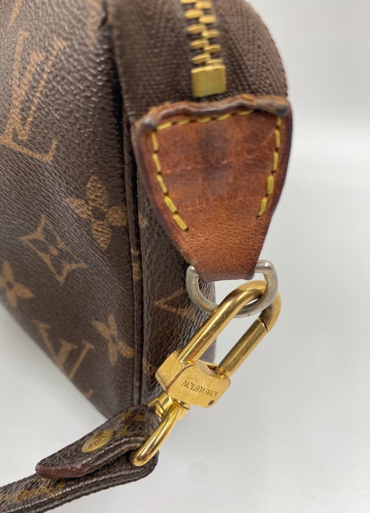 Louis Vuitton Pochette with crossbody strap.