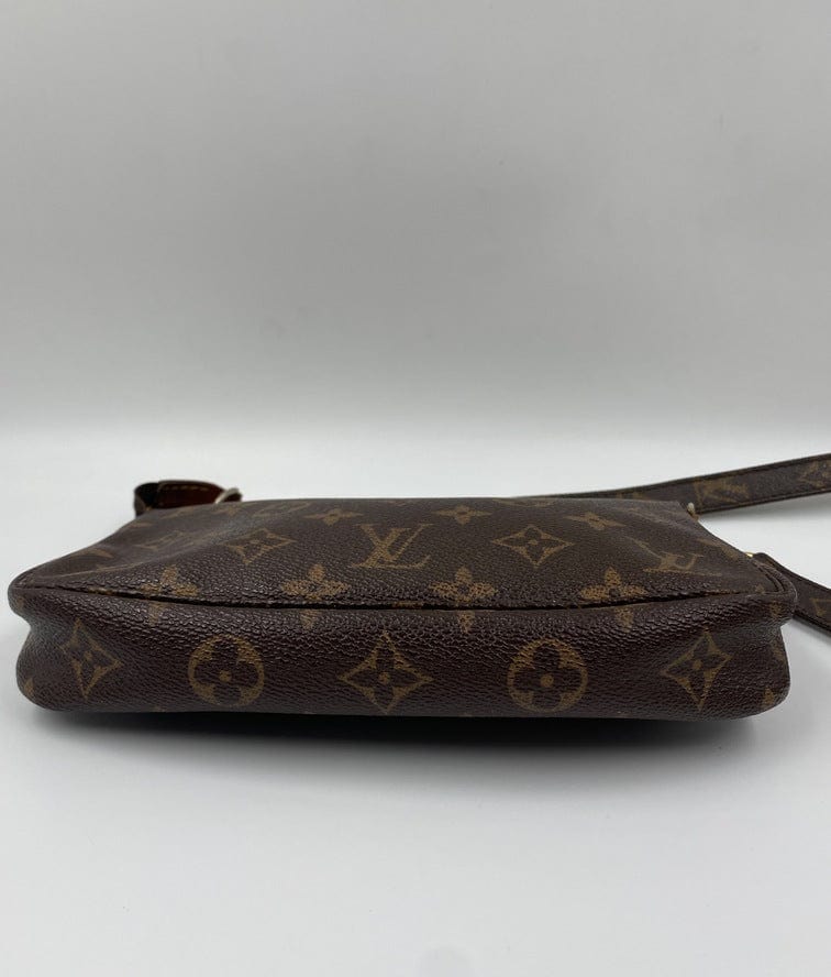 Louis Vuitton Pochette with crossbody strap.