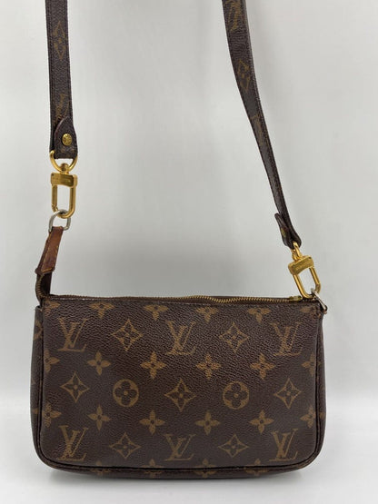 Louis Vuitton Pochette with crossbody strap.