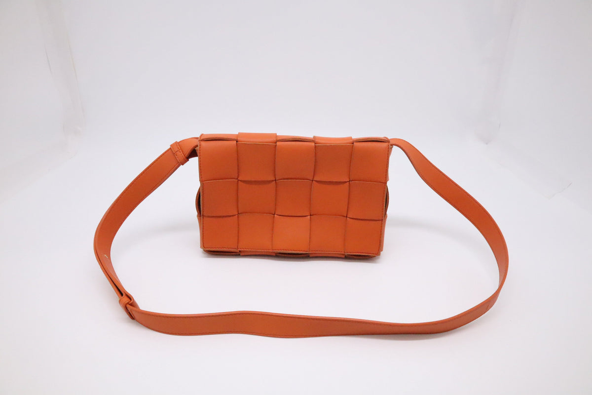 Bottega Veneta Cassette in Orange Intrecciato Leather