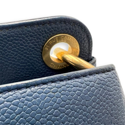 CC Lock Top Handle Bag Blue in Caviar Leather, Gold hardware