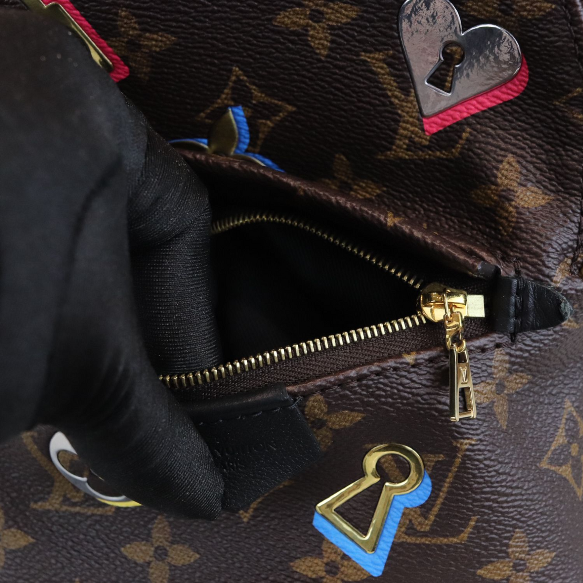 Louis-Vuitton Monogram Love Lock Mini Palm Springs Backpack
