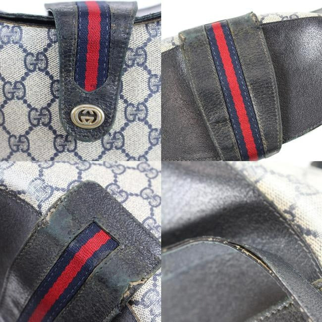 RARE, Gucci, navy blue Guccissima print leather, bucket bag w red & navy striped, top strap & gold GG logo accent