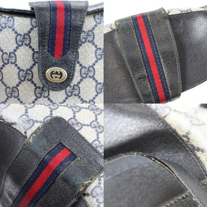 RARE, Gucci, navy blue Guccissima print leather, bucket bag w red & navy striped, top strap & gold GG logo accent