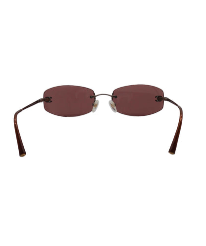 **with caroline stanbury**Chanel Dark Brown Rimless CC Aviators DXBS0932