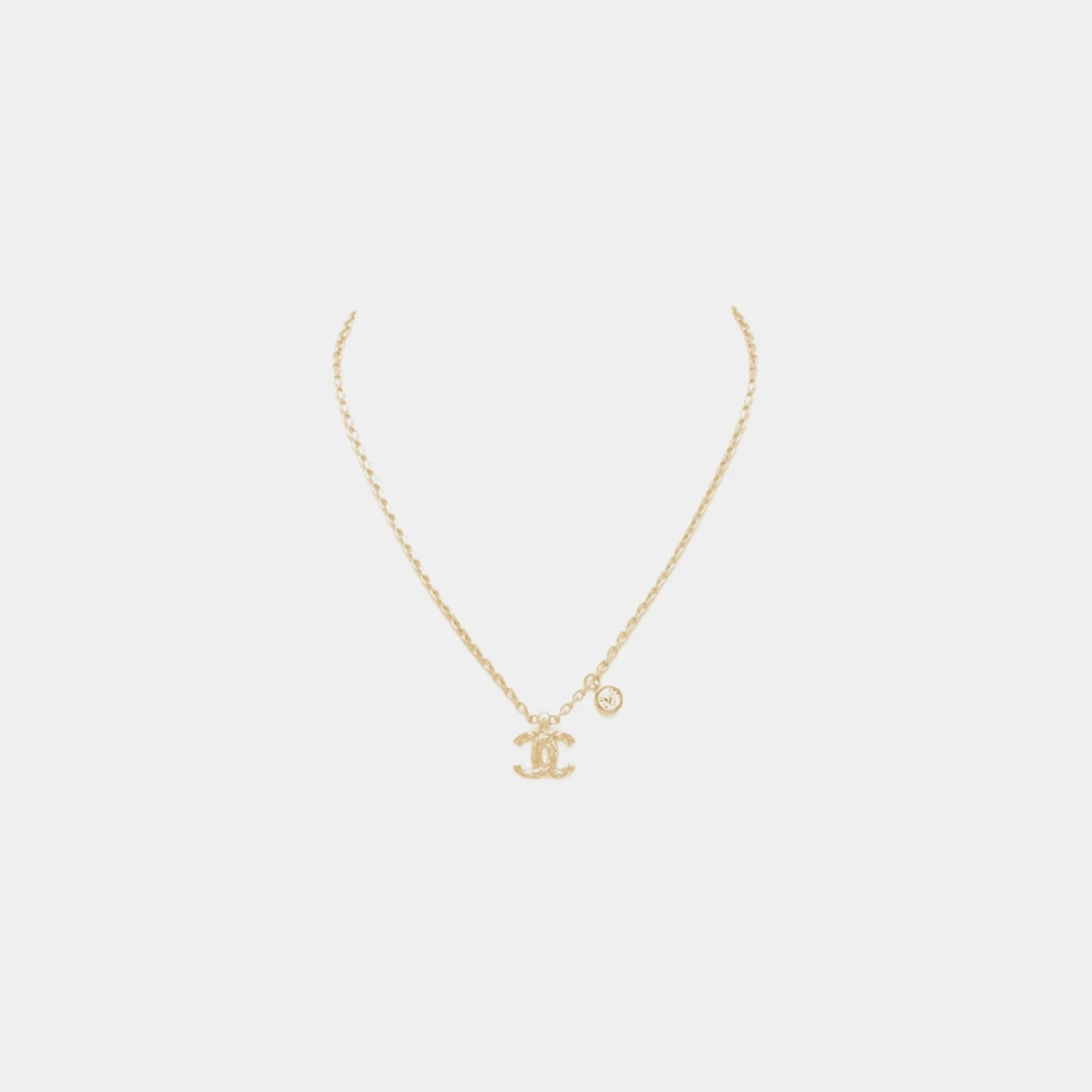Gold Metal CC Pendant Necklace with Crystal Accent